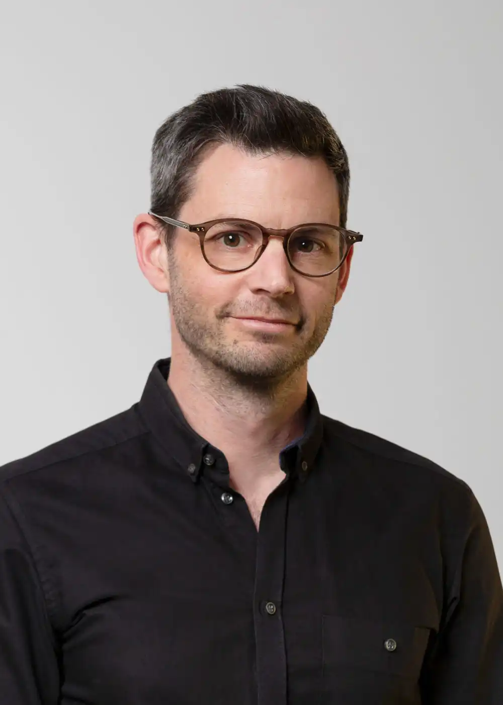 Portrait photograph of Director Tait Oosthuizen